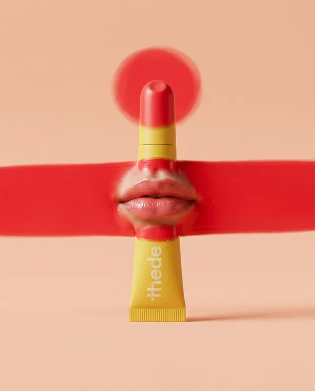 This editorial illustration features a bold interplay of colors, showcasing a lipstick tube at the center with stylized lips emerging from a vivid red stroke against a soft, peach background. The composition conveys a playful and modern aesthetic, emphasizing beauty and creativity.