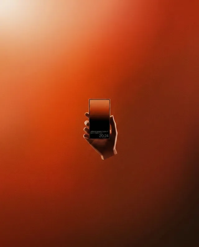 A minimalist illustration features a hand holding a smartphone against a warm, gradient background of deep reds and oranges, evoking a sense of calm and modernity. The design highlights sleek lines and a contemporary aesthetic.