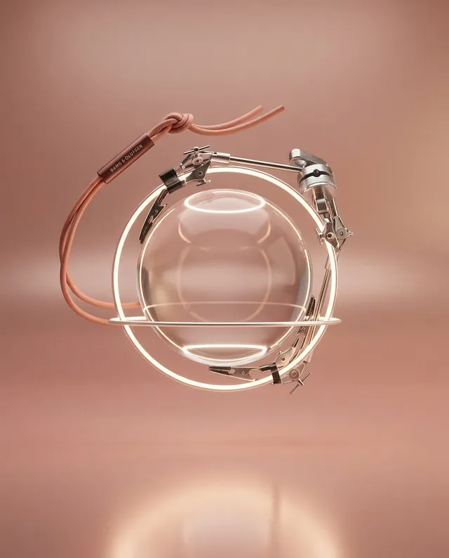 A futuristic, minimalist 3D render features a transparent orb suspended in a delicate metallic frame, accented by warm tones of pink and beige. The scene conveys a sense of elegance and innovation, with soft lighting enhancing its sleek and modern design.