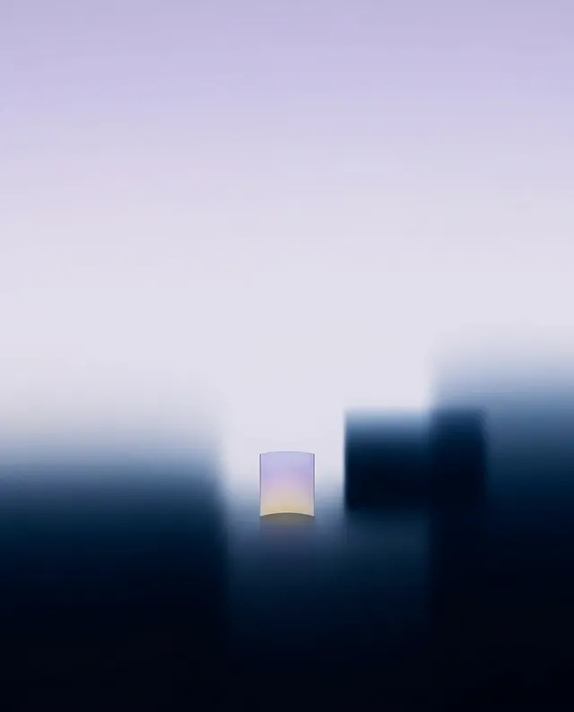A minimalist digital illustration features a soft gradient background transitioning from pale lavender to deep navy blue, with a translucent square at the center reflecting a subtle gradient of light. The serene and abstract composition evokes a tranquil and contemplative mood.