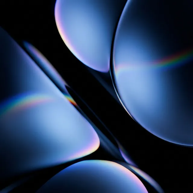 A captivating abstract illustration featuring smooth, rounded forms that reflect subtle rainbows against a dark backdrop. The dominant colors are deep blues and iridescent highlights, creating a serene and otherworldly mood.